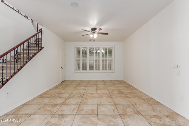 unfurnished room with ceiling fan