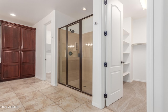 bathroom featuring an enclosed shower