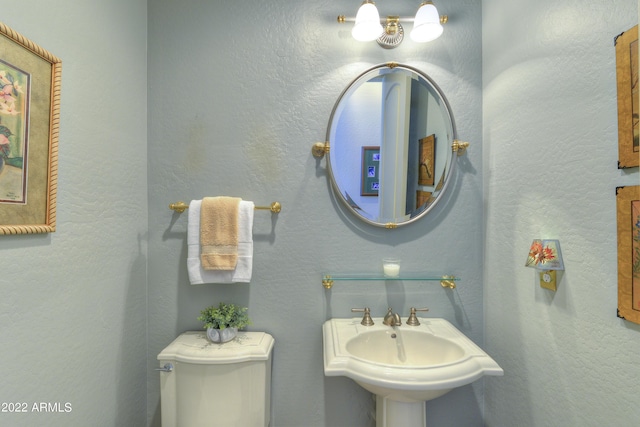 bathroom with toilet and sink