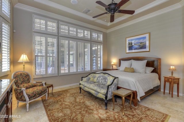 tiled bedroom featuring a tray ceiling, multiple windows, ceiling fan, and crown molding