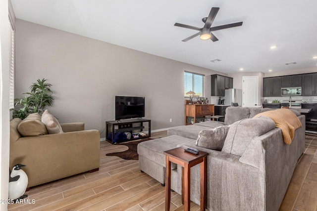 living room featuring ceiling fan