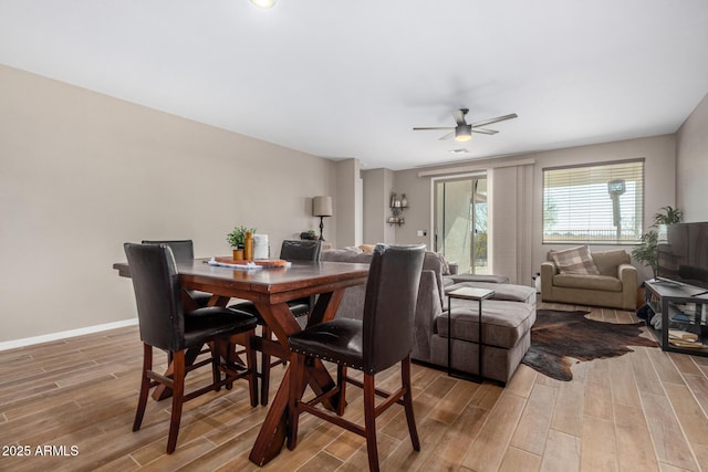 dining space with ceiling fan