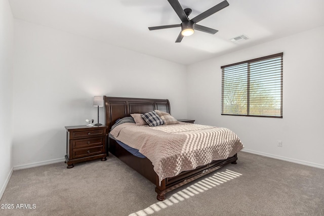 bedroom featuring light colored carpet and ceiling fan