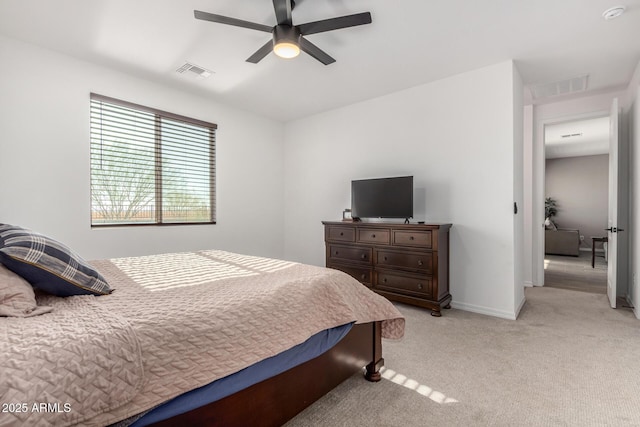 bedroom with light carpet and ceiling fan