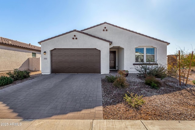 mediterranean / spanish-style house featuring a garage