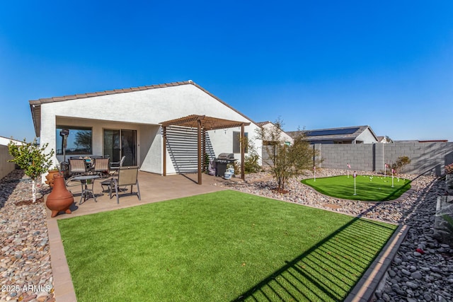 back of property with a pergola and a patio