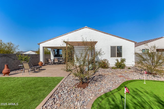 back of property with a patio area