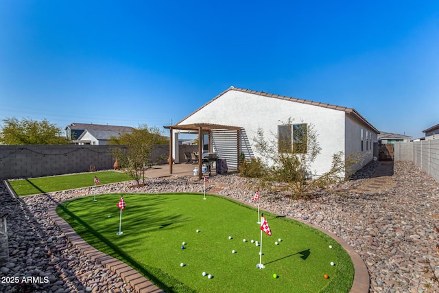 back of property featuring a pergola and a patio area