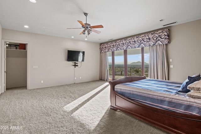 carpeted bedroom featuring access to exterior and ceiling fan