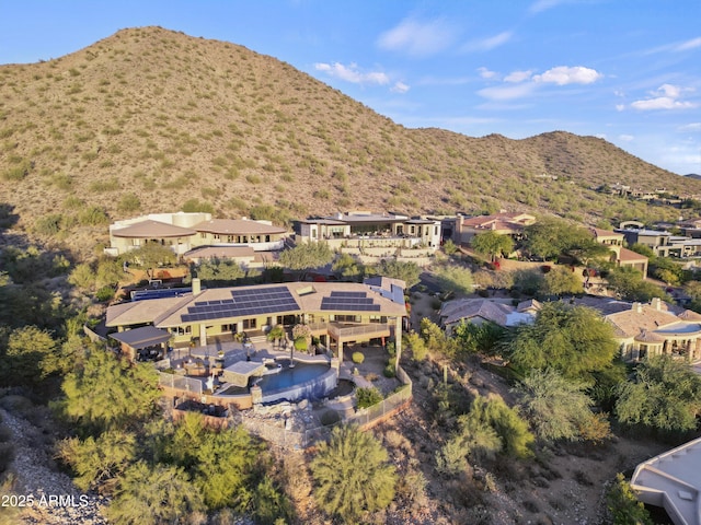 birds eye view of property with a mountain view