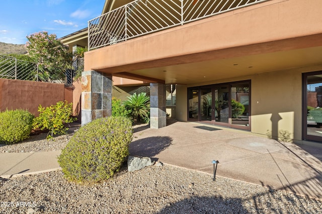 view of patio featuring a balcony