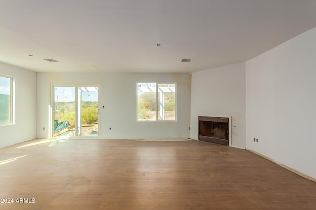 unfurnished living room featuring hardwood / wood-style floors