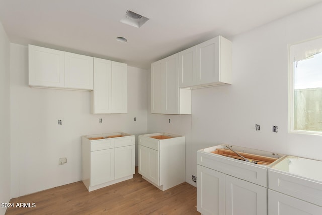 kitchen featuring white cabinetry and light wood-type flooring