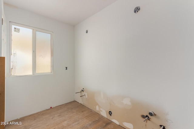 laundry area featuring light hardwood / wood-style flooring