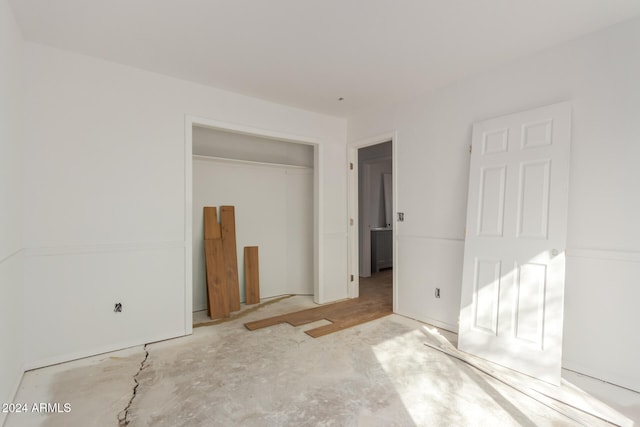 unfurnished bedroom with a closet