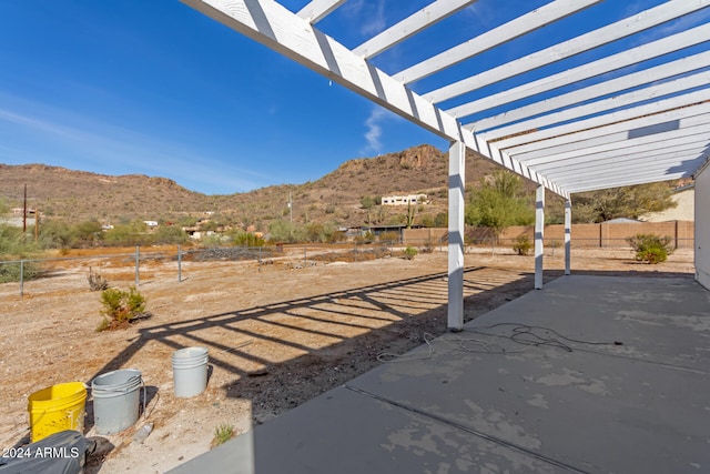 view of yard with a mountain view, a patio, and a pergola