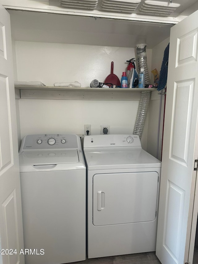 washroom with washing machine and clothes dryer