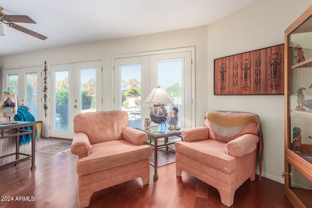 living area featuring french doors, dark hardwood / wood-style floors, and ceiling fan