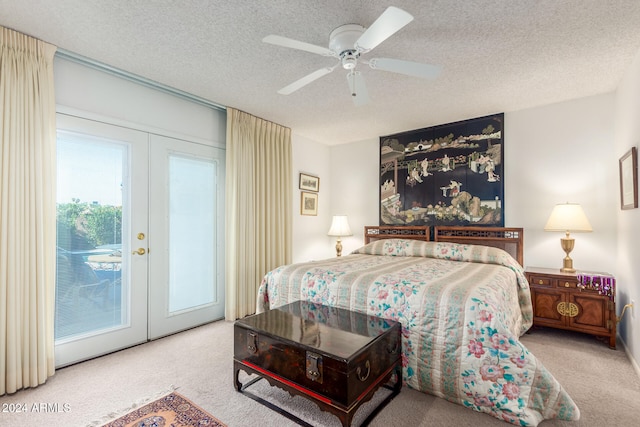 bedroom with light carpet, ceiling fan, a textured ceiling, french doors, and access to outside