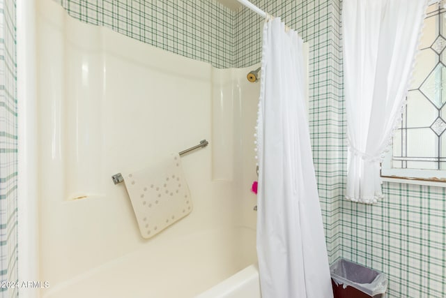 bathroom featuring shower / bath combination with curtain