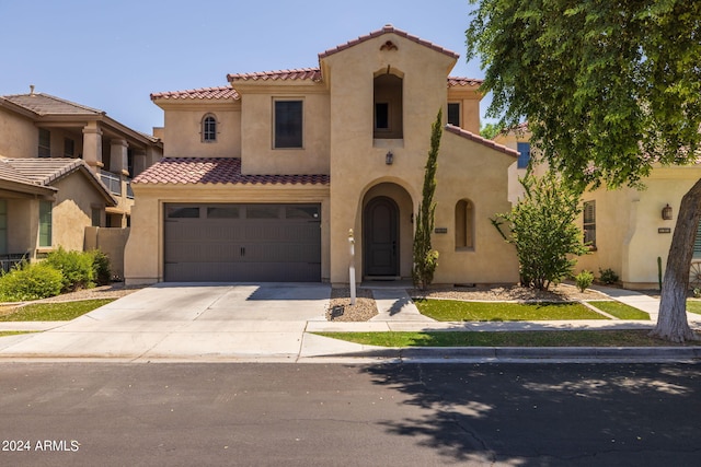 mediterranean / spanish-style home featuring a garage