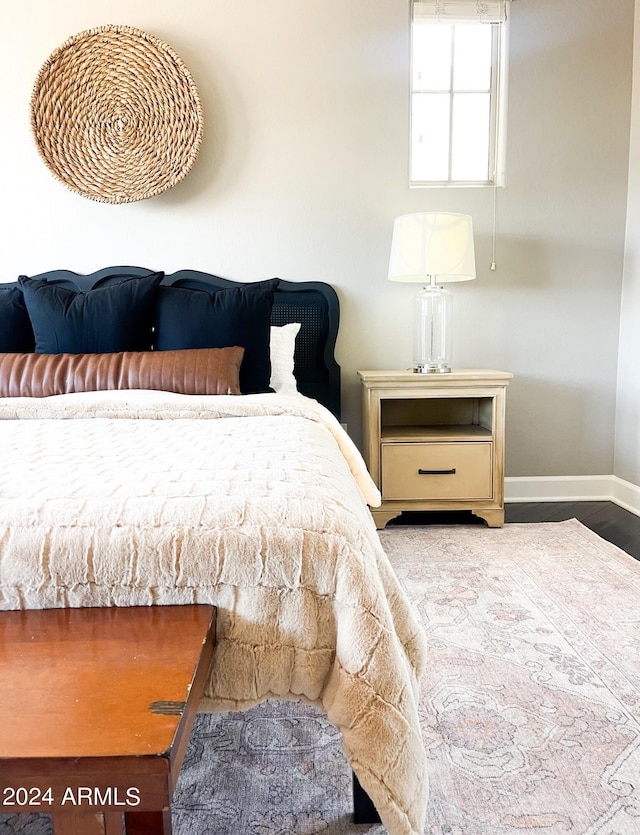 bedroom with hardwood / wood-style flooring