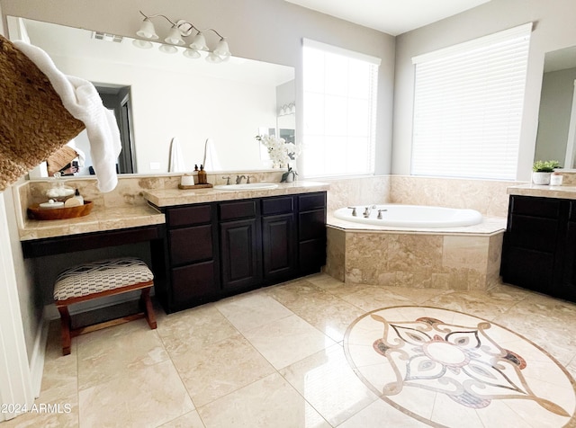 bathroom with vanity and tiled bath