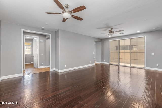 spare room featuring dark hardwood / wood-style floors and ceiling fan