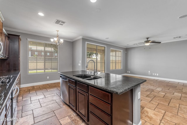 kitchen with sink, crown molding, stainless steel appliances, and an island with sink