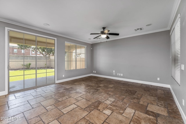 spare room featuring ornamental molding and ceiling fan