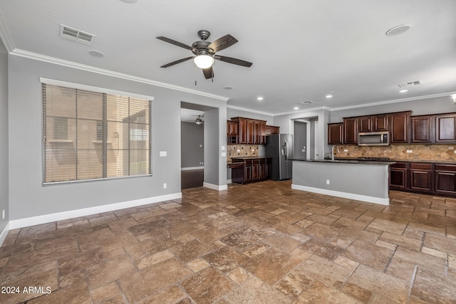 kitchen featuring dark brown cabinets, appliances with stainless steel finishes, an island with sink, ceiling fan, and backsplash