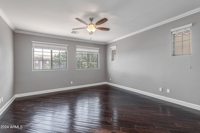 spare room featuring crown molding, dark hardwood / wood-style floors, and ceiling fan