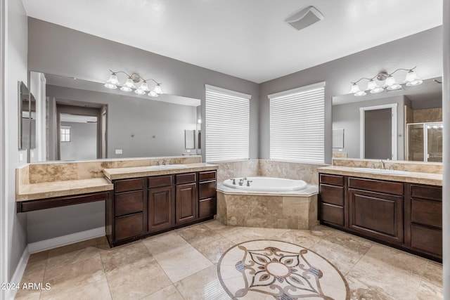 bathroom featuring vanity and shower with separate bathtub