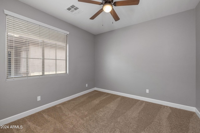 carpeted empty room with ceiling fan