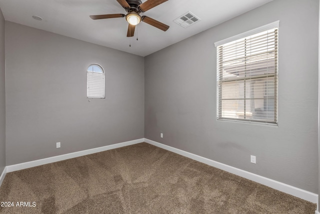 carpeted empty room with ceiling fan