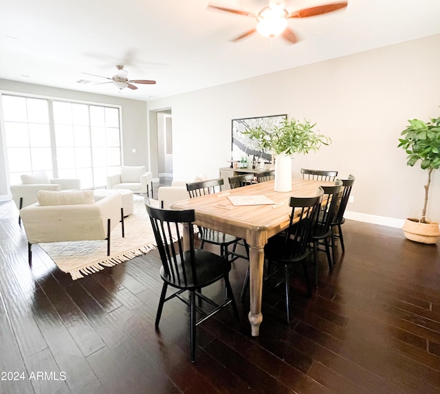 dining room with dark wood-type flooring and ceiling fan