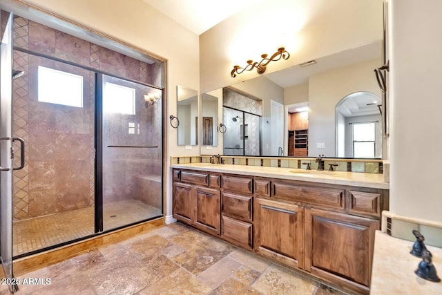 bathroom featuring vanity and walk in shower