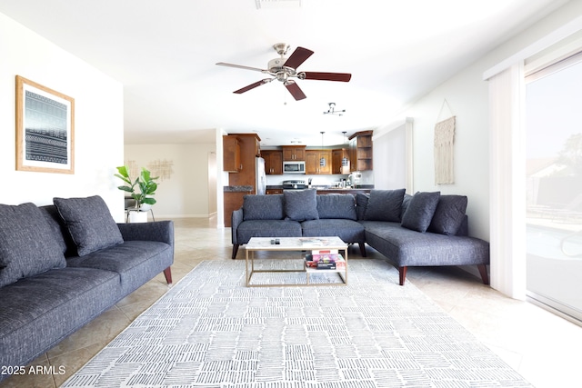 3907 E Marilyn Rd, Phoenix, AZ 85032 - living room featuring light tile patterned floors, ceiling fan, and baseboards
