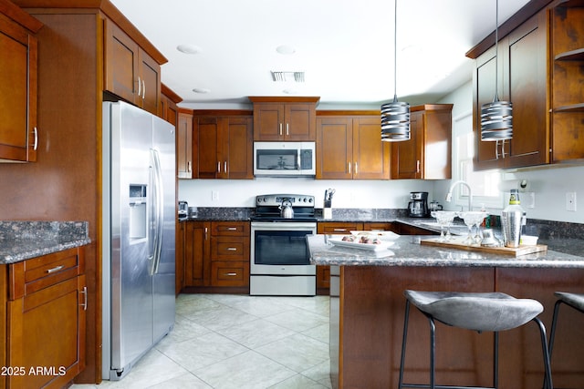 3907 E Marilyn Rd, Phoenix, AZ 85032 - kitchen featuring stainless steel appliances, a peninsula, open shelves, light tile patterned floors, and hanging light fixtures