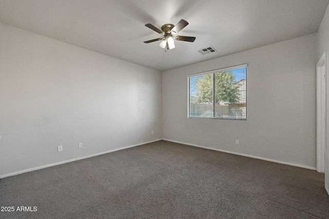 unfurnished room with ceiling fan and dark colored carpet