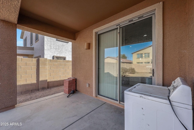 view of patio with washer and dryer