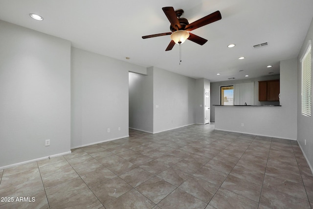 unfurnished living room with ceiling fan and light tile patterned flooring