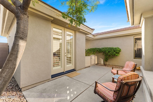 doorway to property featuring a patio and french doors