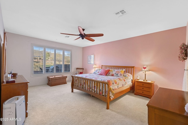 bedroom featuring ceiling fan and light colored carpet