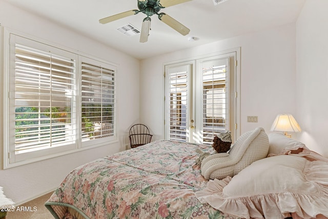 carpeted bedroom featuring access to outside and ceiling fan