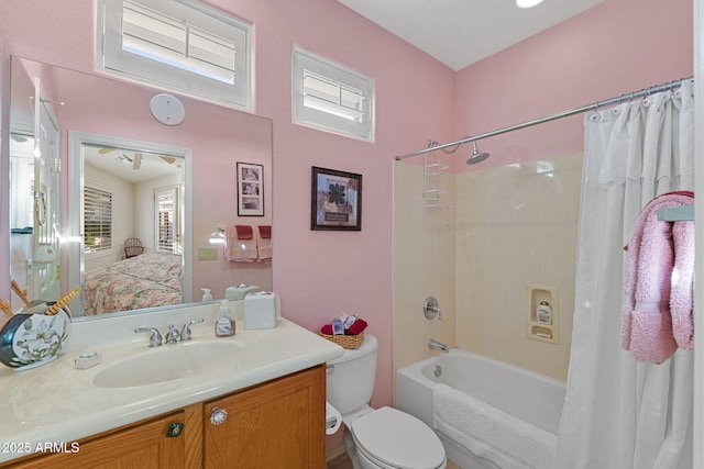 full bathroom with toilet, shower / bathtub combination with curtain, and vanity