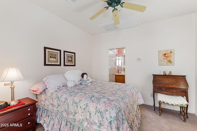 carpeted bedroom with ceiling fan and ensuite bath