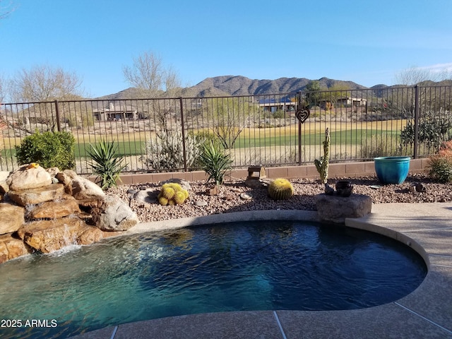 view of swimming pool featuring a mountain view