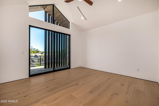 8038 E Clarendon Ave, Scottsdale, AZ 85251 - spare room featuring ceiling fan, wood finished floors, high vaulted ceiling, and recessed lighting