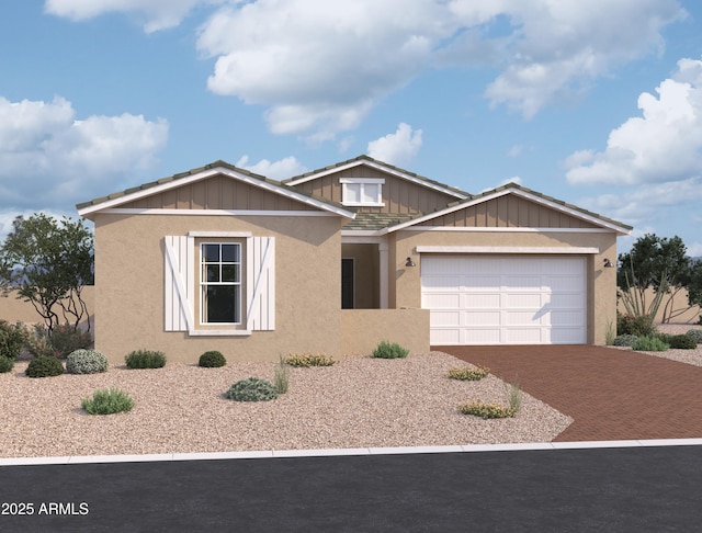 view of front of home with board and batten siding, decorative driveway, an attached garage, and stucco siding